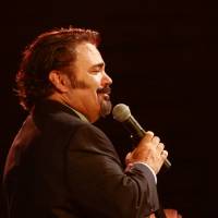 Vince Valenzuela takes the mic on the comedy stage. 